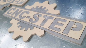 flowJET Water Jet Cutter cuts two coloured ceramic tiles